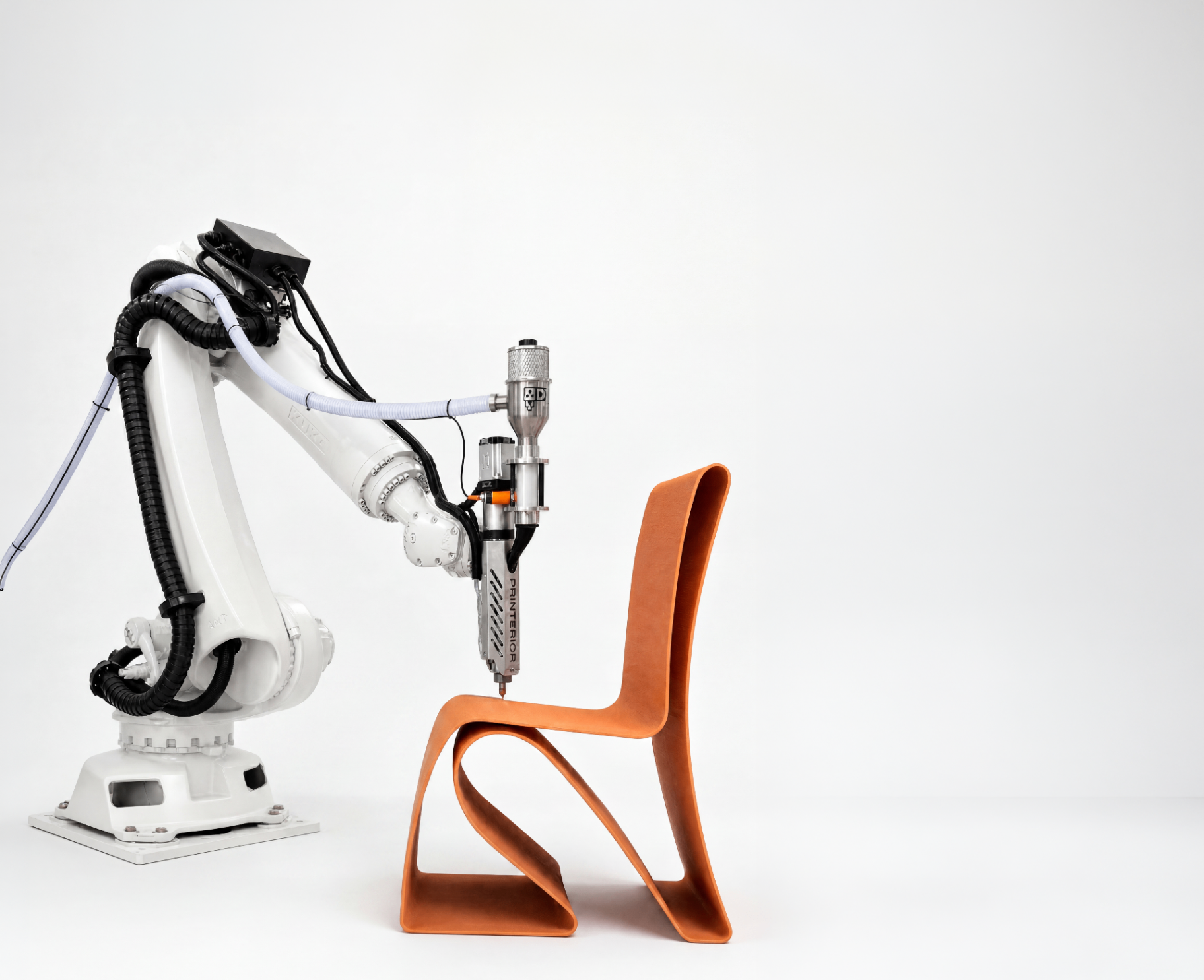 Industrial robotic arm large-format 3D printing a terracotta ribbon chair at the Printerior additive manufacturing studio